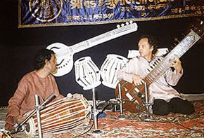 Performing the tarapan with a pakhawaj player at Varanasi music conference in 1994 Performing the tarapan with a pakhawaj player at Varanasi music conference in 1994